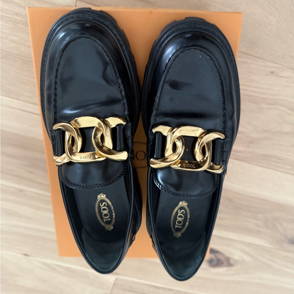 Tod's Black and Gold Loafers
